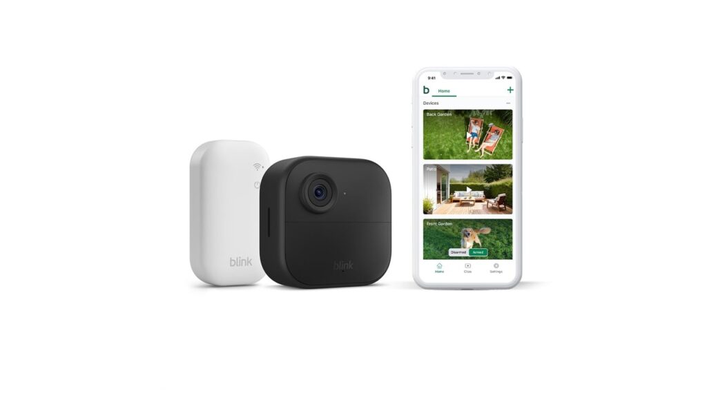 Image shows the Blink Outdoor 4 security camera with the Sync Module and the Blink app on a mobile phone.